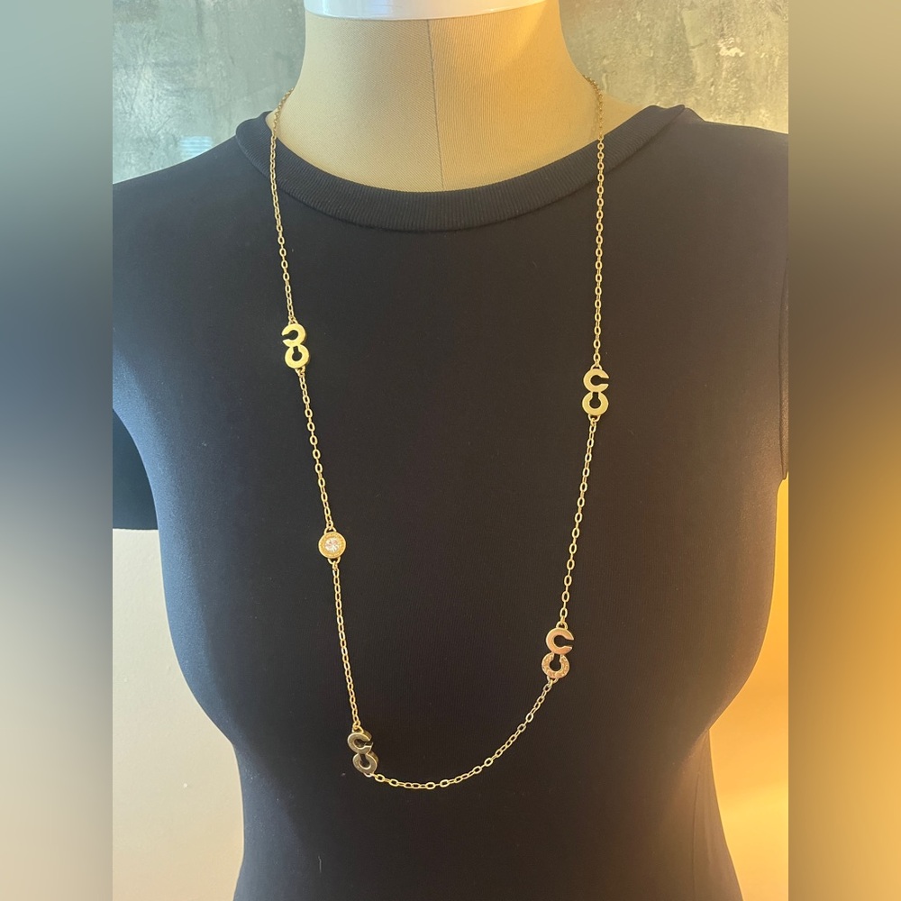 Coach signature c logo gold tone necklace. 36 inches